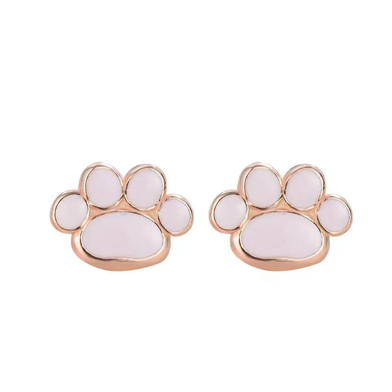 Handmade 925 silver cat paw ear studs in white gold colour finish on a white surface