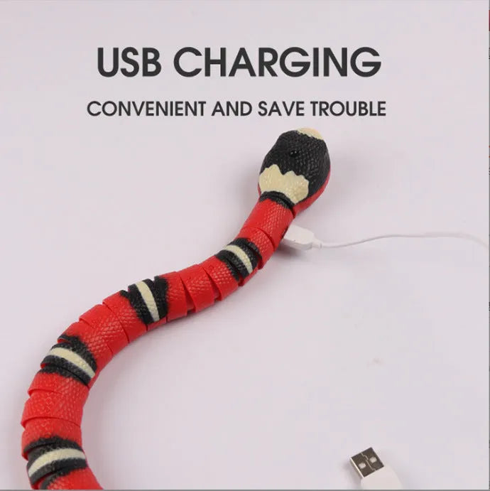 Interactive electric induction snake cat toy with S-shaped body, flashing eyes, and retractable tongue on a floor