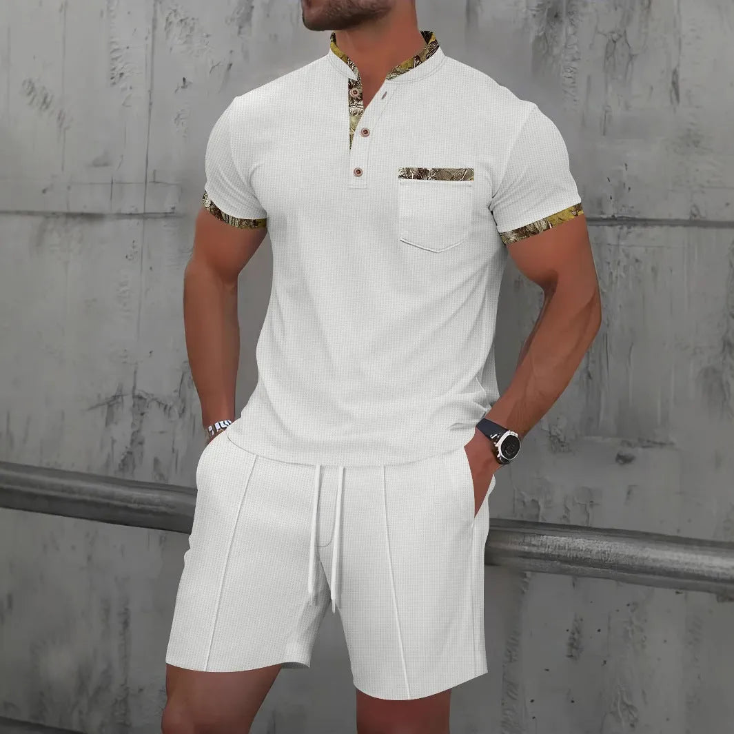 Man wearing a grey short sleeve zippered polo top and matching shorts, a casual cotton blend suit set.