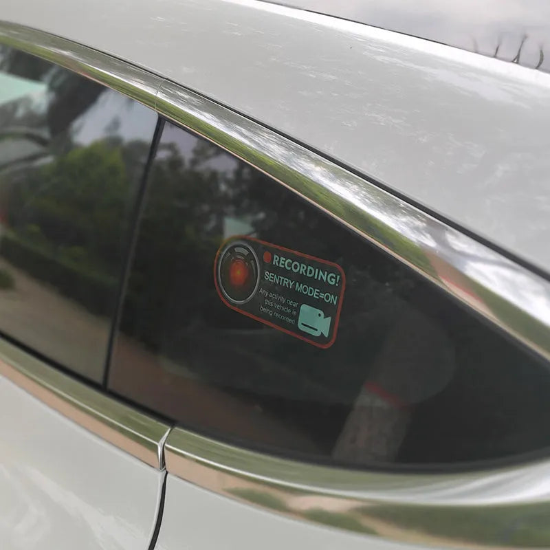 Tesla Sentry Mode electrostatic warning sticker measuring 11x5cm with English security text