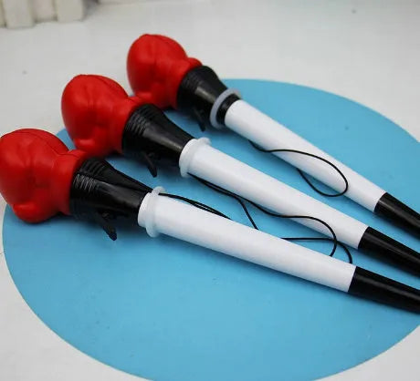Four black pressure relief pens with boxing press ejection fidget mechanism and 0.7mm tips.