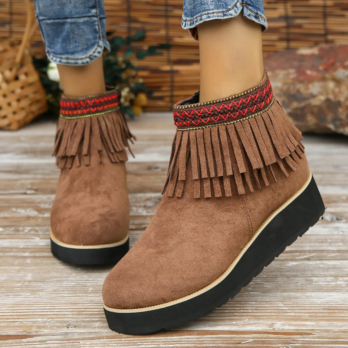 Women's suede wedge ankle boot with side zipper and tassel detail in black