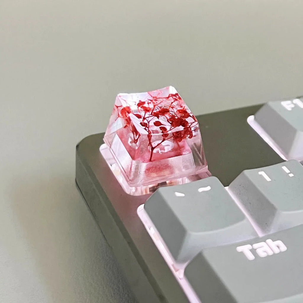 Resin starry sky keycap for mechanical keyboards in transparent design with glitter particles