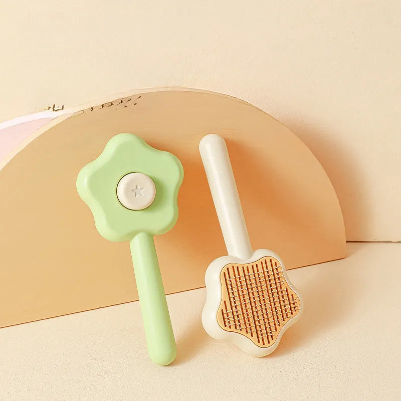 Magic wand cat comb with stainless steel needle teeth and self-cleaning mechanism in green colour