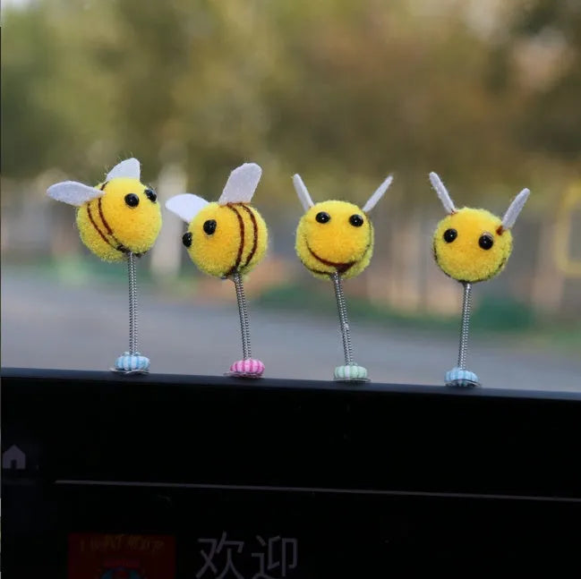 Swing spring bee car decoration made from soft fur ball material measuring 3x3cm