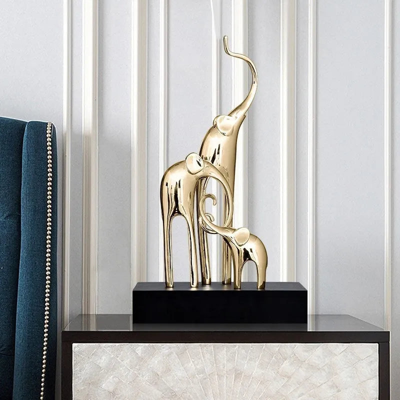 Resin elephant decorative ornament in metallic gold finish measuring 6.5cm tall