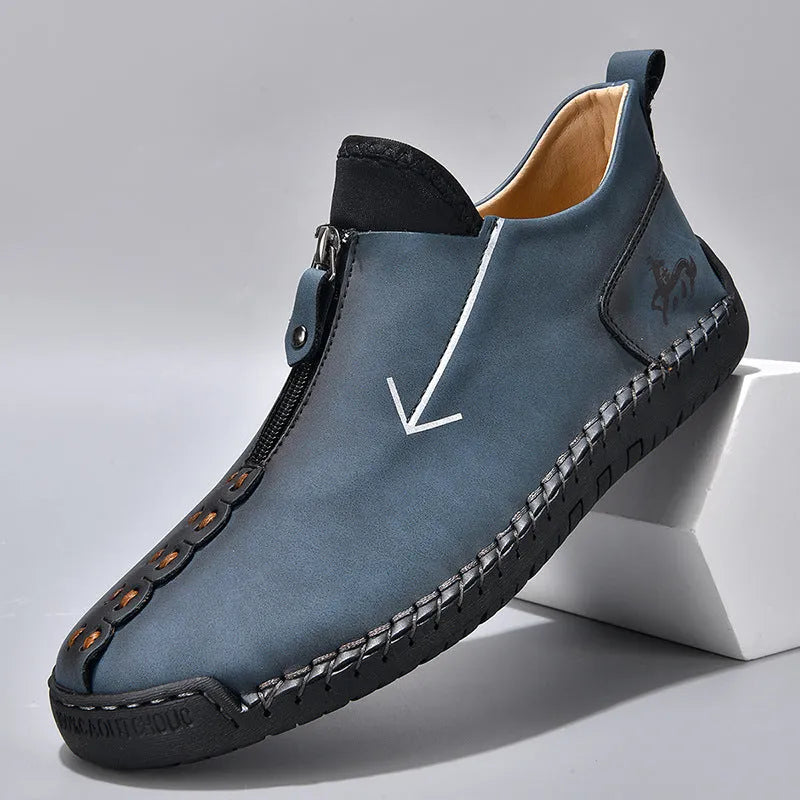 Men's brown casual leather-style boots with a front zip, round toe, and mid-calf height.