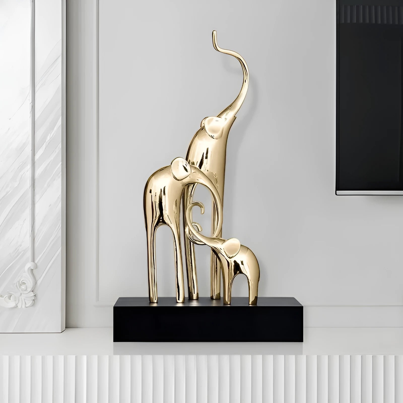 Resin elephant decorative ornament in metallic gold finish measuring 6.5cm tall