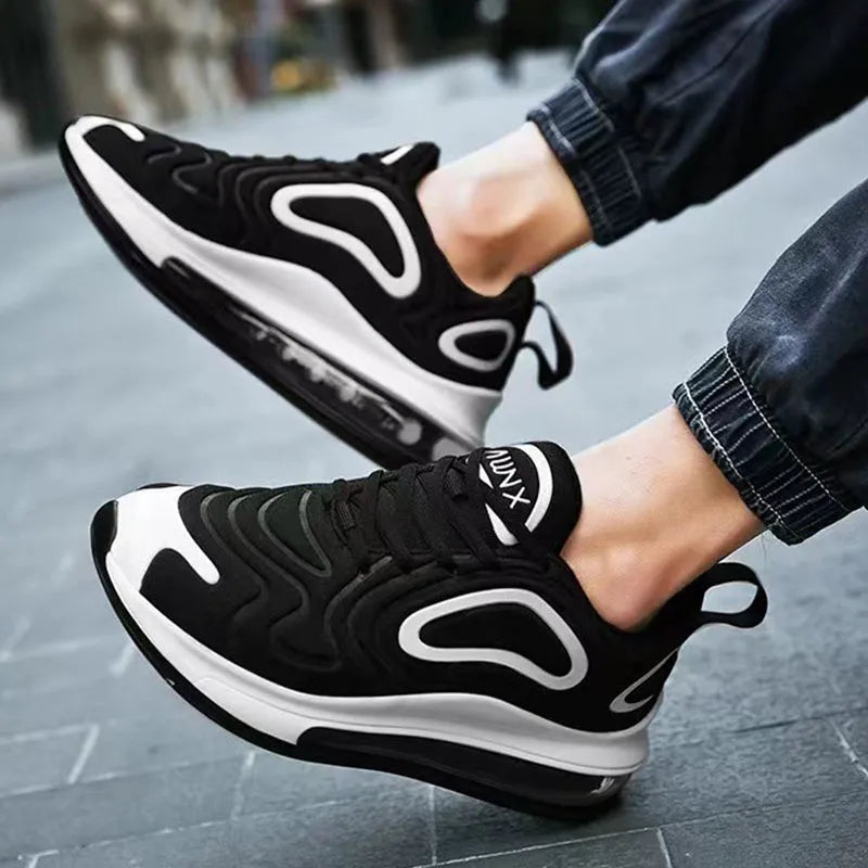 Men's black casual air cushion sneakers with lace-up front and thick sole.
