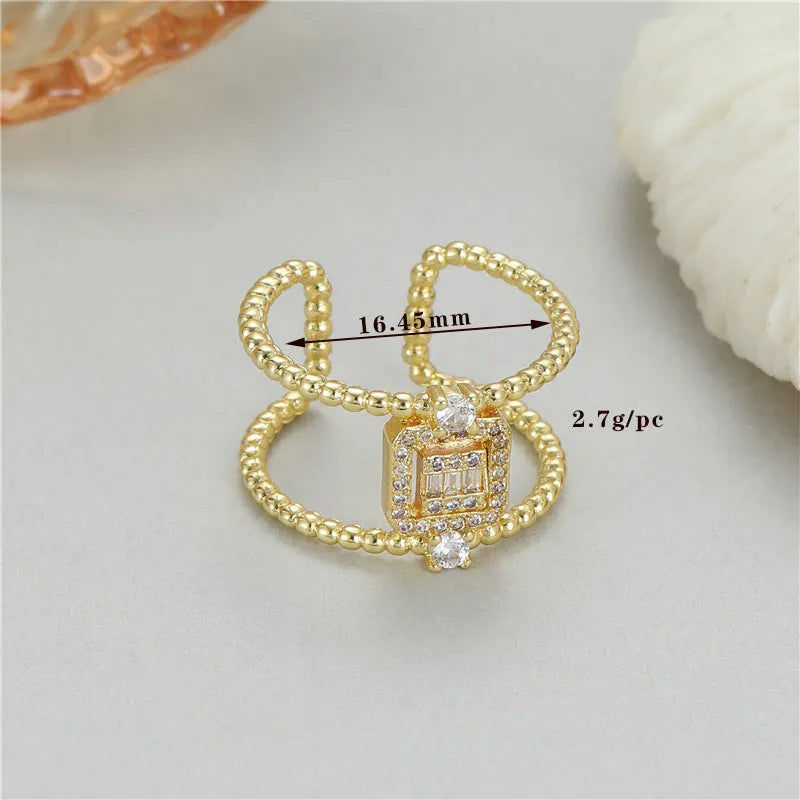 Adjustable open ring with asymmetric U-shape design in 14K gold-plated copper, colour H-12813.
