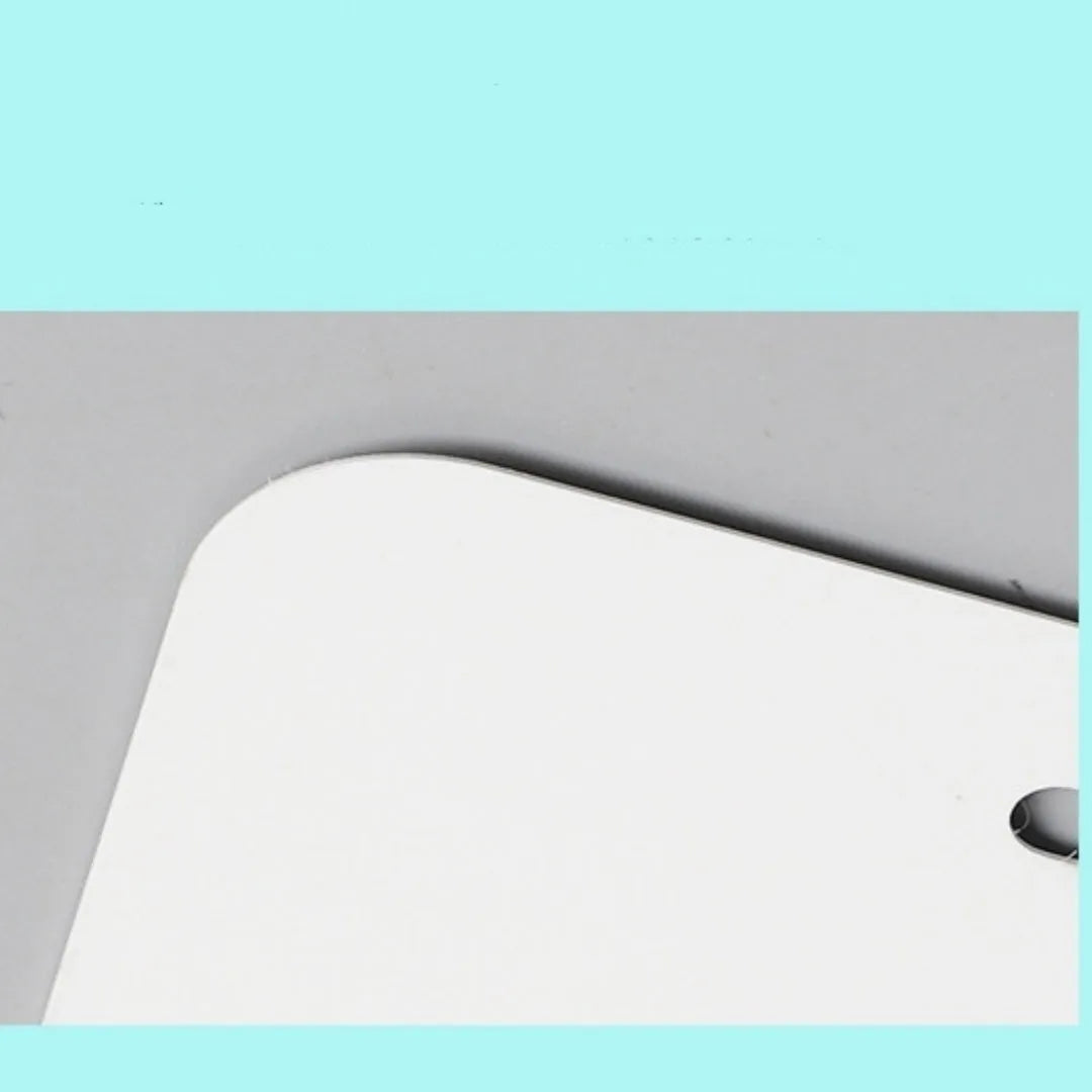 A single white rectangular aluminium licence plate blank metal sheet on a grey background.