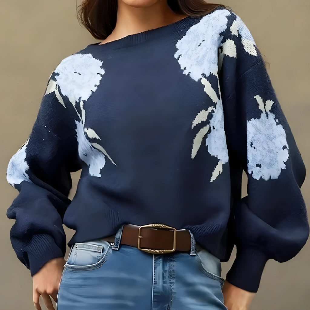 Sapphire blue women's loose pullover with a white floral jacquard pattern, off-neck design, and long sleeves.