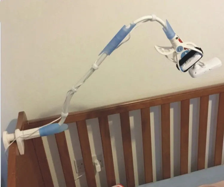 White no-drill baby camera bracket with flexible arm and anti-slip clamp attached to a desk