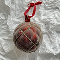 Handmade glass Christmas ball pendant 8cm in green colour hanging on tree branch