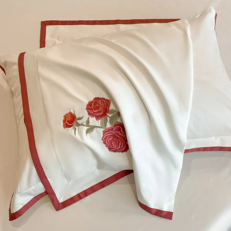 Cotton four-piece bedding set in solid colour with embroidery, includes quilt cover, bed sheet, and pillowcases