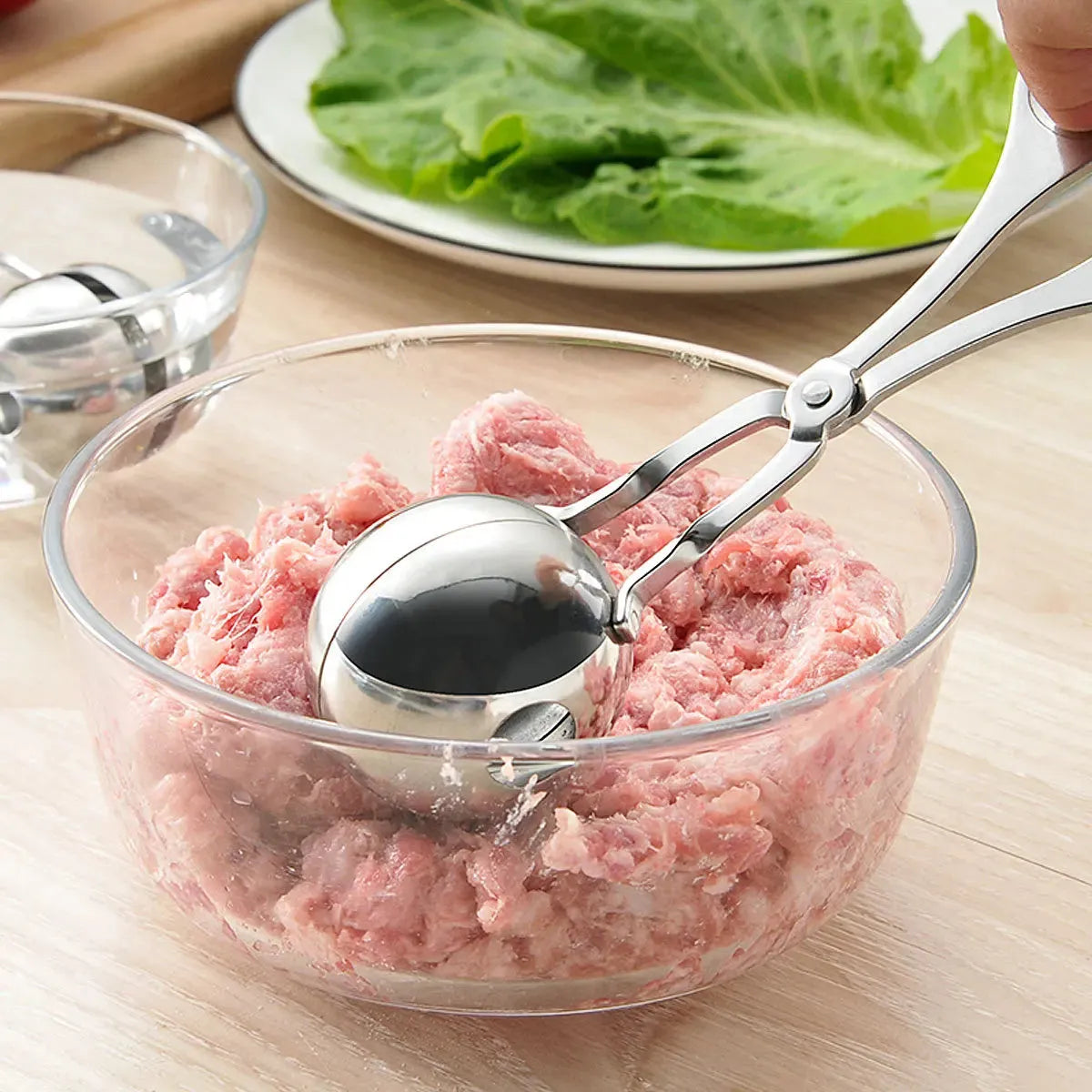 304 stainless steel meatball maker tongs on plain background, shows clip design and two size options, 16.5 cm length