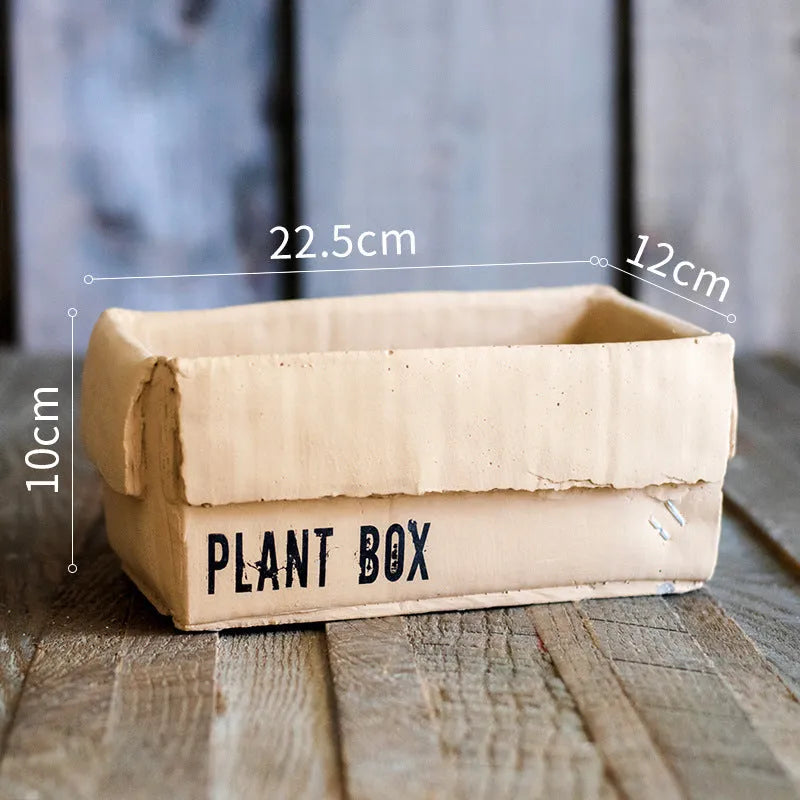 Cement brown paper box style flowerpot with bottom drainage holes for indoor planting