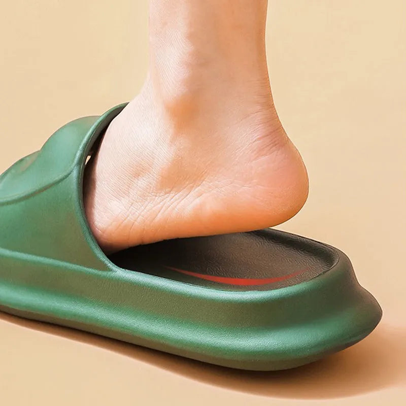 Unisex EVA flip-flop slippers with thick sole, shown in various colours on a bathroom tile floor.