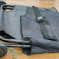 Black aluminium alloy foldable pet stretcher for large dogs, shown in a folded position.