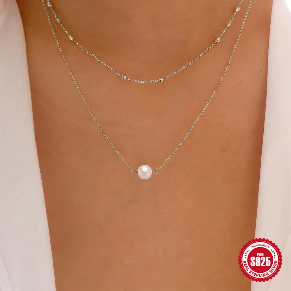 S925 sterling silver necklace with double layer design and twin pearls in gold or white gold colour