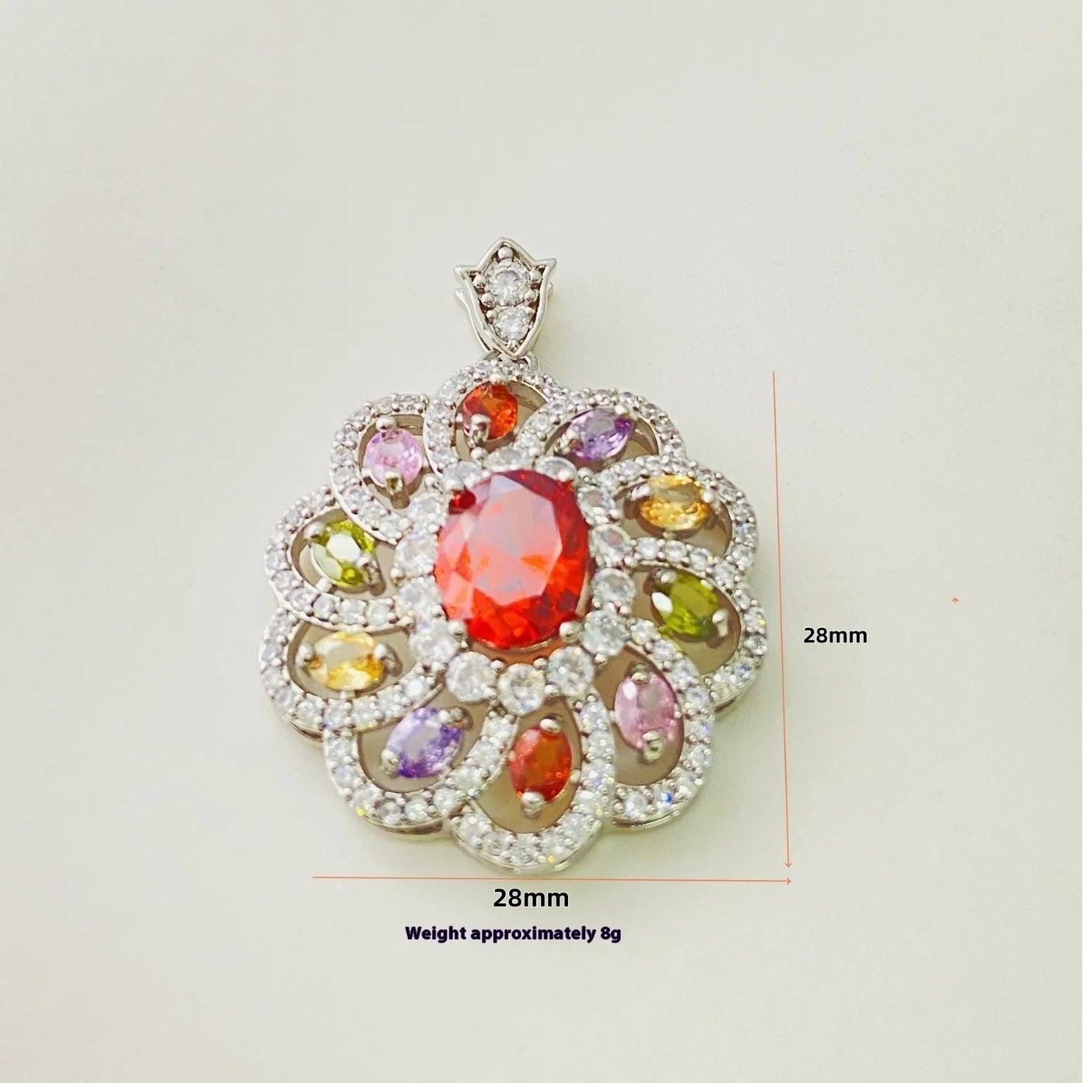 Close-up of a colourful zircon flower pendant necklace in a gold finish, showing floral detail.