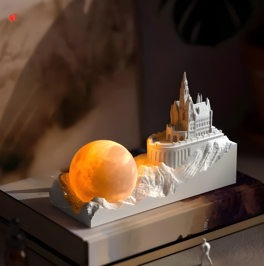 Small mountain-shaped LED night light with touch control, shown as part of a gift box set with essential oil and card for bedroom or desktop decoration.