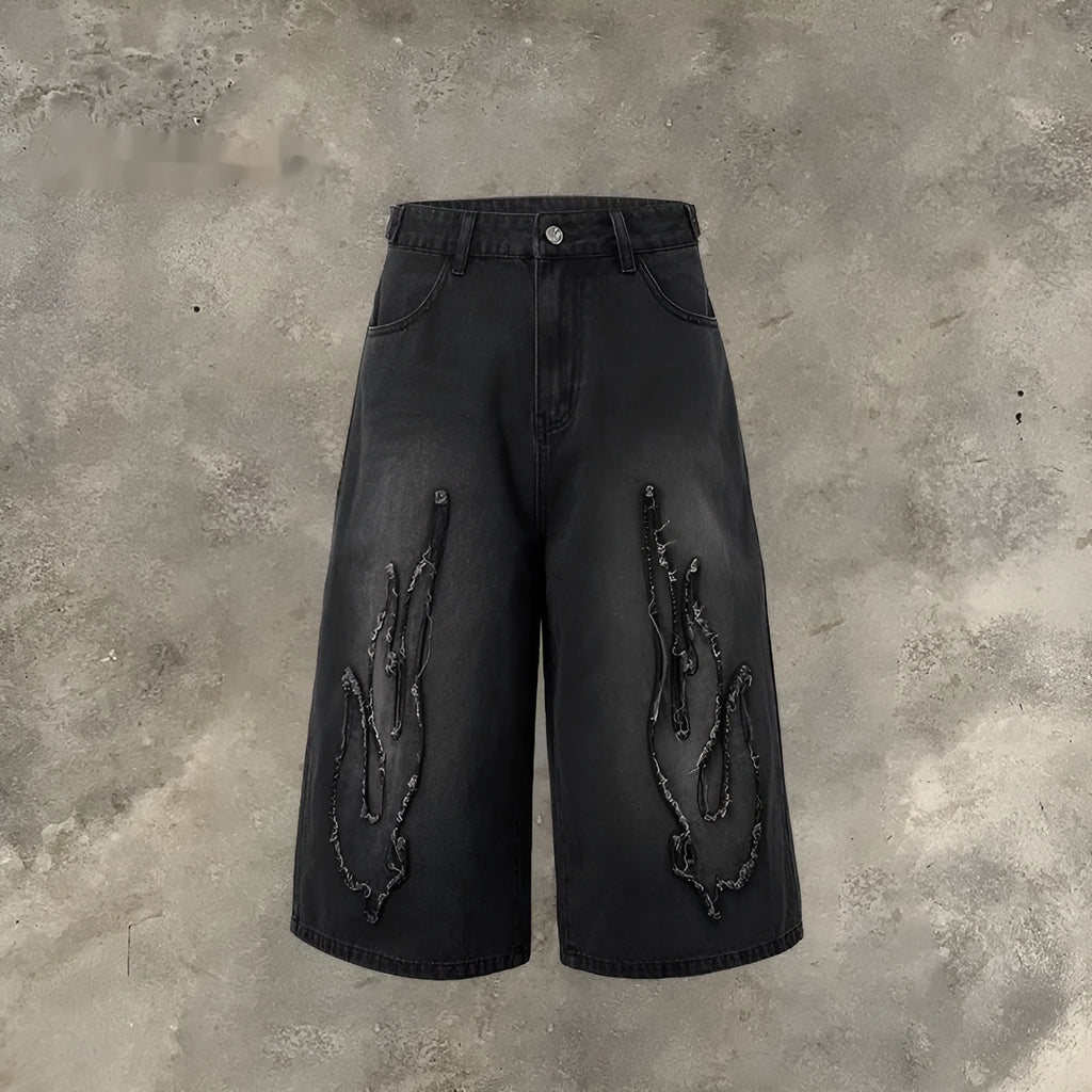 Men's black cropped denim shorts with flame embroidery patches on straight-leg cut