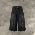 Men's black cropped denim shorts with flame embroidery patches on straight-leg cut