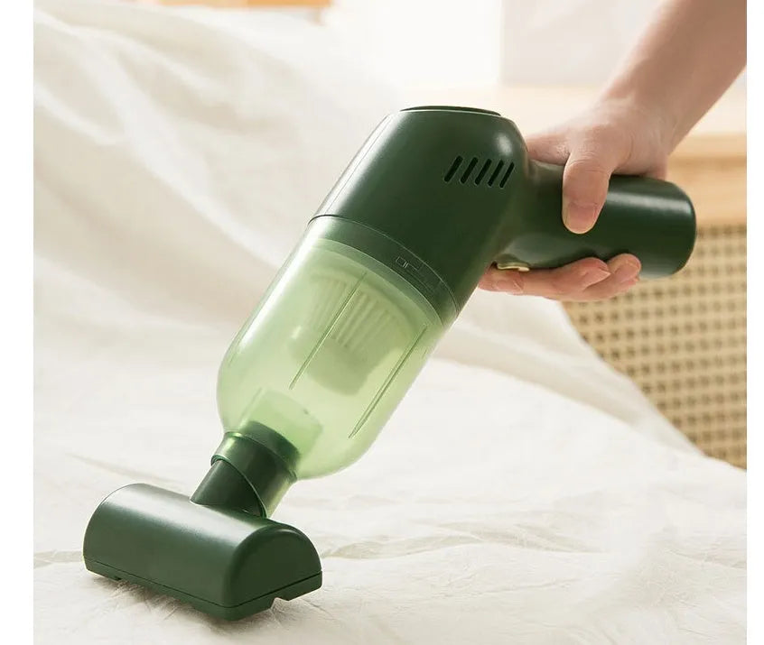 Electric cat and dog hair suction cleaner in green, USB powered, 244x72x157mm, with two suction heads on a fabric surface.