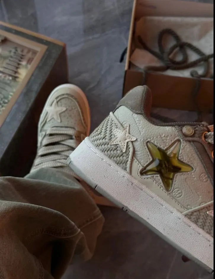 Green casual sneakers with star pattern and round toe design