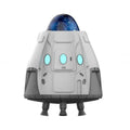White space capsule shaped Bluetooth Northern Lights ambience light with remote control on a dark surface.
