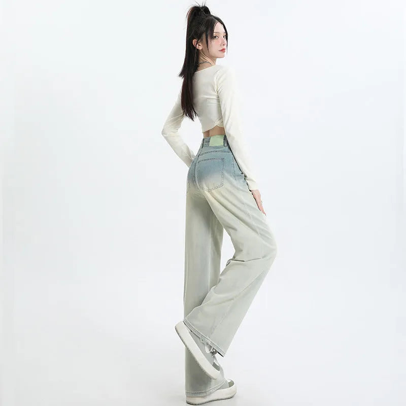 Women's gradient blue straight-leg denim trousers showing colour gradation effect and contemporary cut