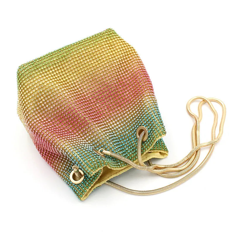 Rhinestone bucket bag with diamond studded design and rainbow chain strap