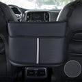 Black leather car seat gap storage organiser bag with carbon fibre pattern, shown between car seats.