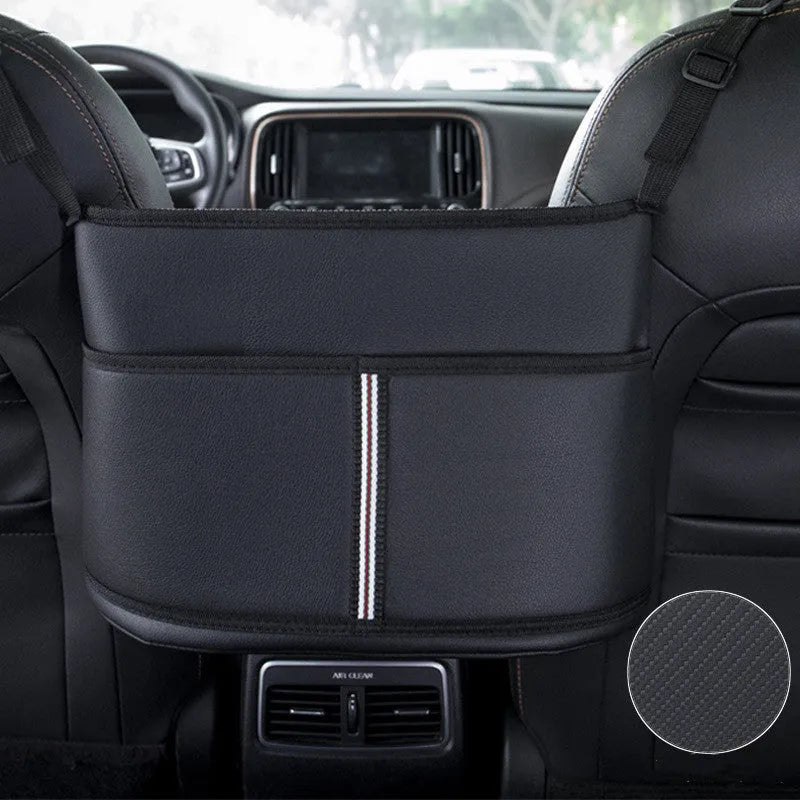 Black leather car seat gap storage organiser bag with carbon fibre pattern, shown between car seats.