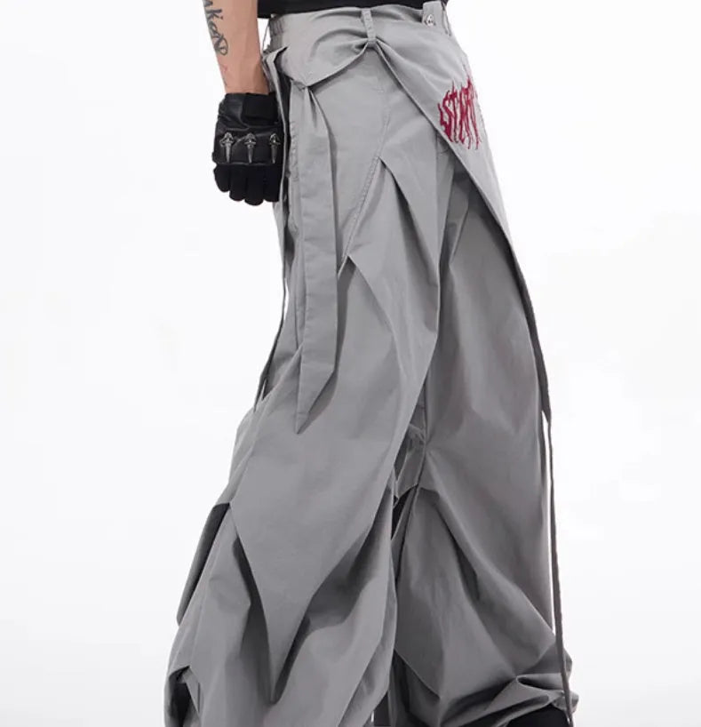 Boy modelling black wide-leg summer trousers with a relaxed fit and Korean-inspired style.