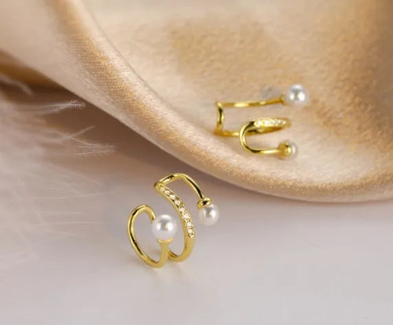 Silver plated pearl ear clips for unpierced ears, shown as a gold or silver pair in Japanese Korean style.