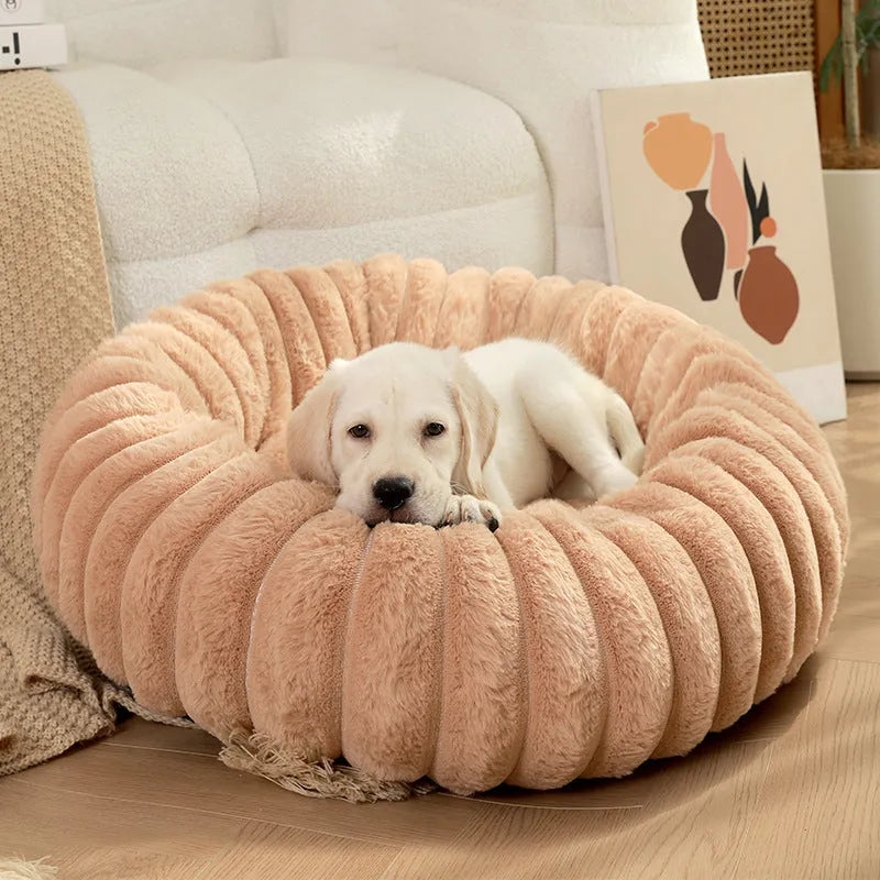 Round long plush dog bed in gray on floor, super soft warm pet sofa with raised edges