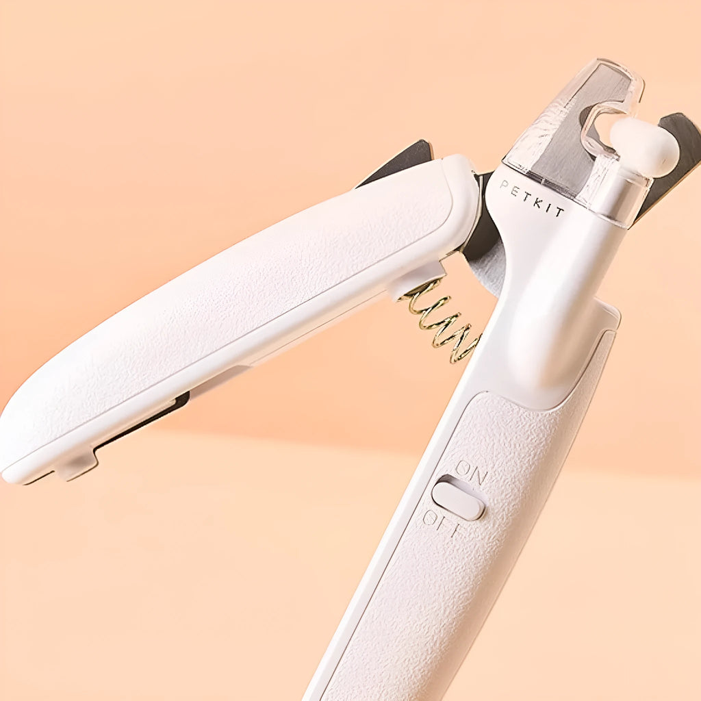 White LED pet nail clipper with transparent splash guard and triangular blade for cats and dogs