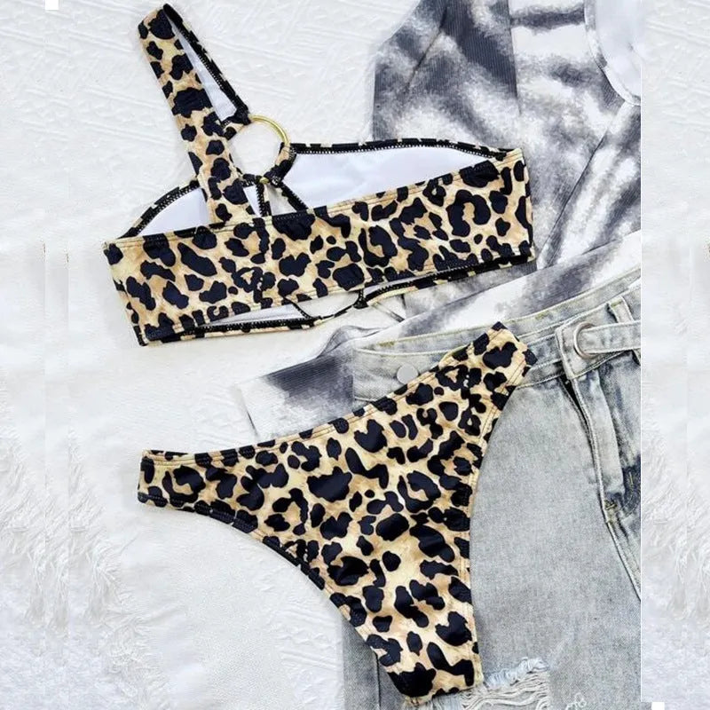 Women's hollow leopard print polka dot nylon bikini set with top and shorts, available in S M L sizes