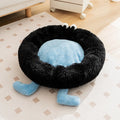 Blue Elf Briquettes plush kennel pet bed with raised bolster edge for dogs or cats, shown in a home setting.