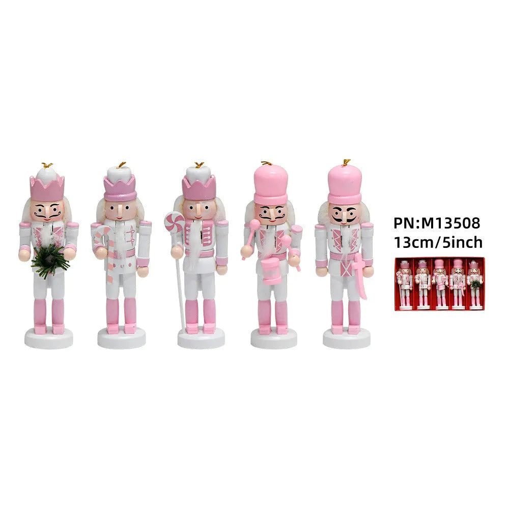 Five pink wooden nutcracker soldier puppets each 13cm tall arranged as Christmas garland ornaments