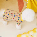 Beige dog jumper with colourful ball bear print, made from cotton and spandex.