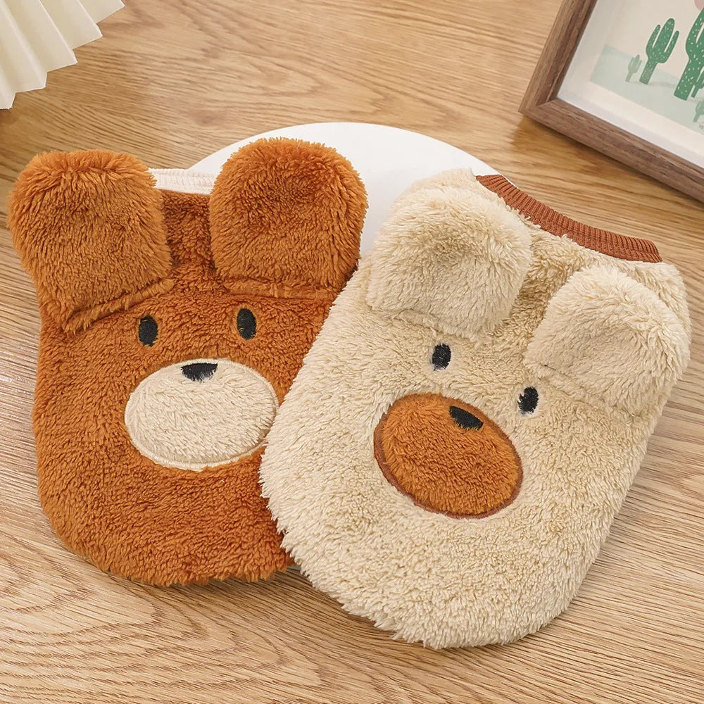 Fleece-lined warm dog clothes in cream with brown bear ears on a small dog
