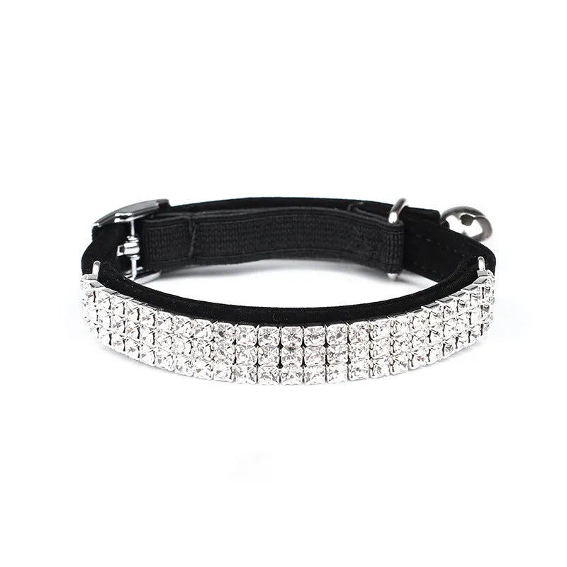 Red velvet cat collar with rhinestones, adjustable buckle, shown on a white background.