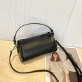 Soft vegetable tanning leather cylindrical crossbody phone bag in six colour options on a white background.