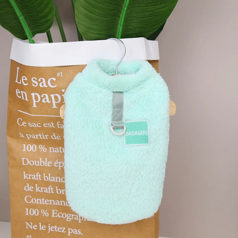 A blue coral fleece jacket for pets with five multi-coloured pull rings for adjustment on the front.