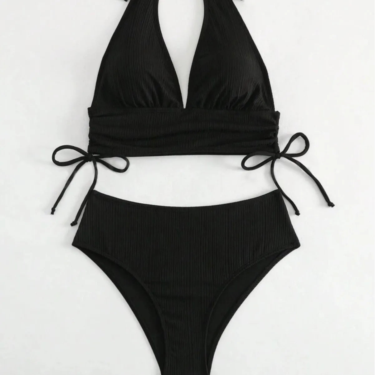 Women's black lace-up halter bikini set with brief bottoms on mannequin