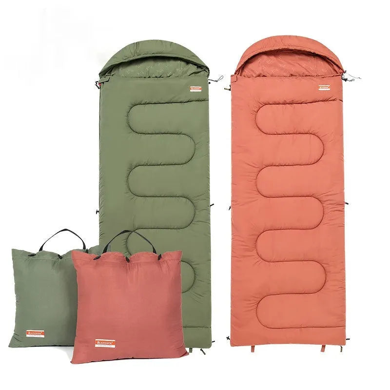 Ochre and olive green portable cotton camping sleeping bag quilt laid out flat.