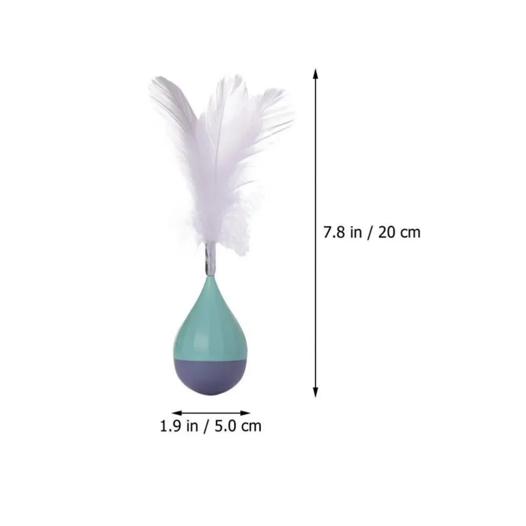 Green feather tumbler cat toy with goose feathers and aluminium alloy components on wooden floor